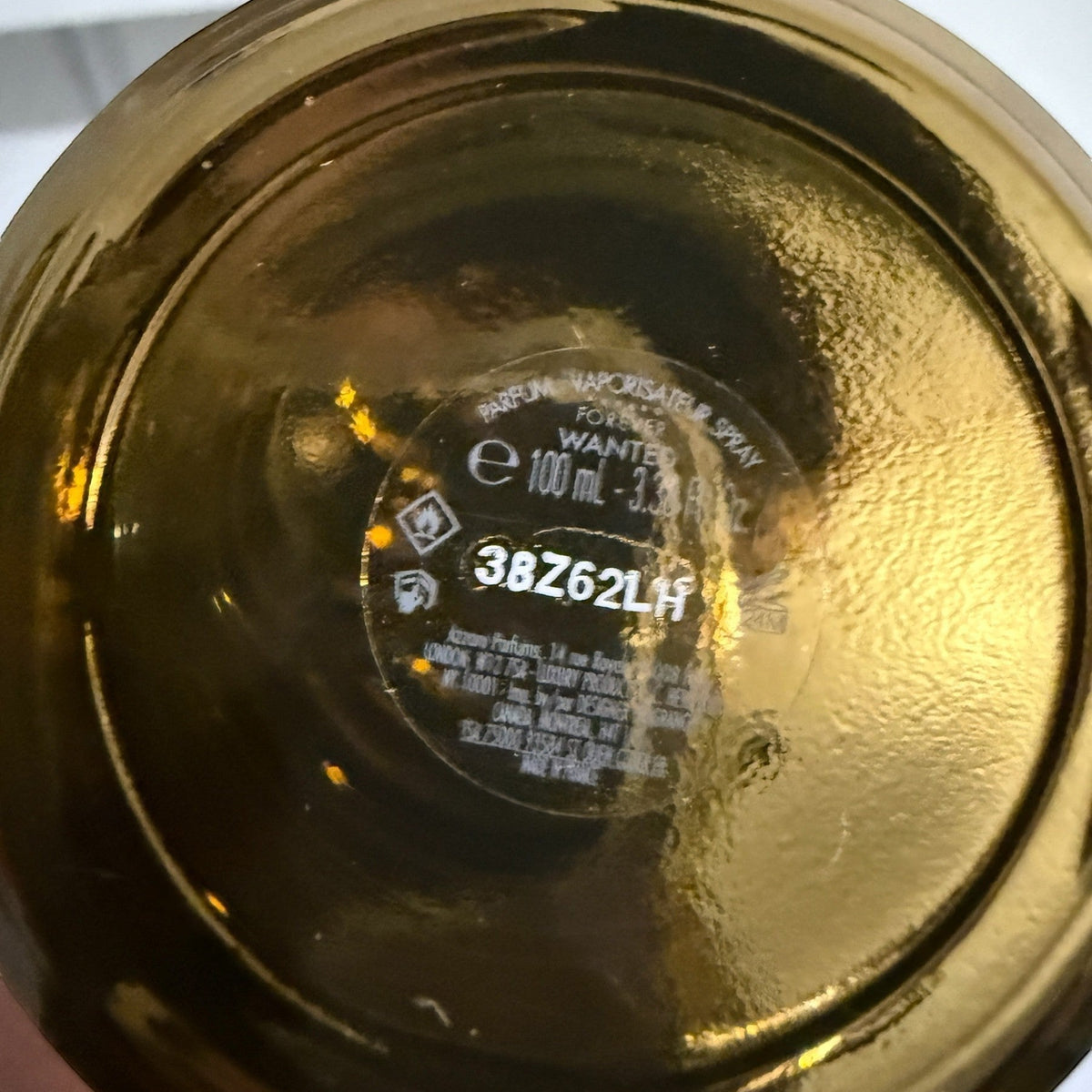 decantME Azzaro Forever Wanted Elixir perfume bottle base showing batch code 38Z62LH and 100ml volume details