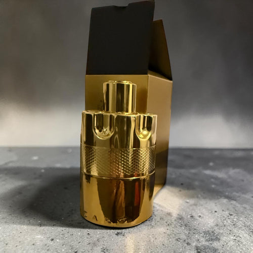 decantME Azzaro Wanted Elixir fragrance decant in a metallic gold revolver cylinder bottle with dark packaging