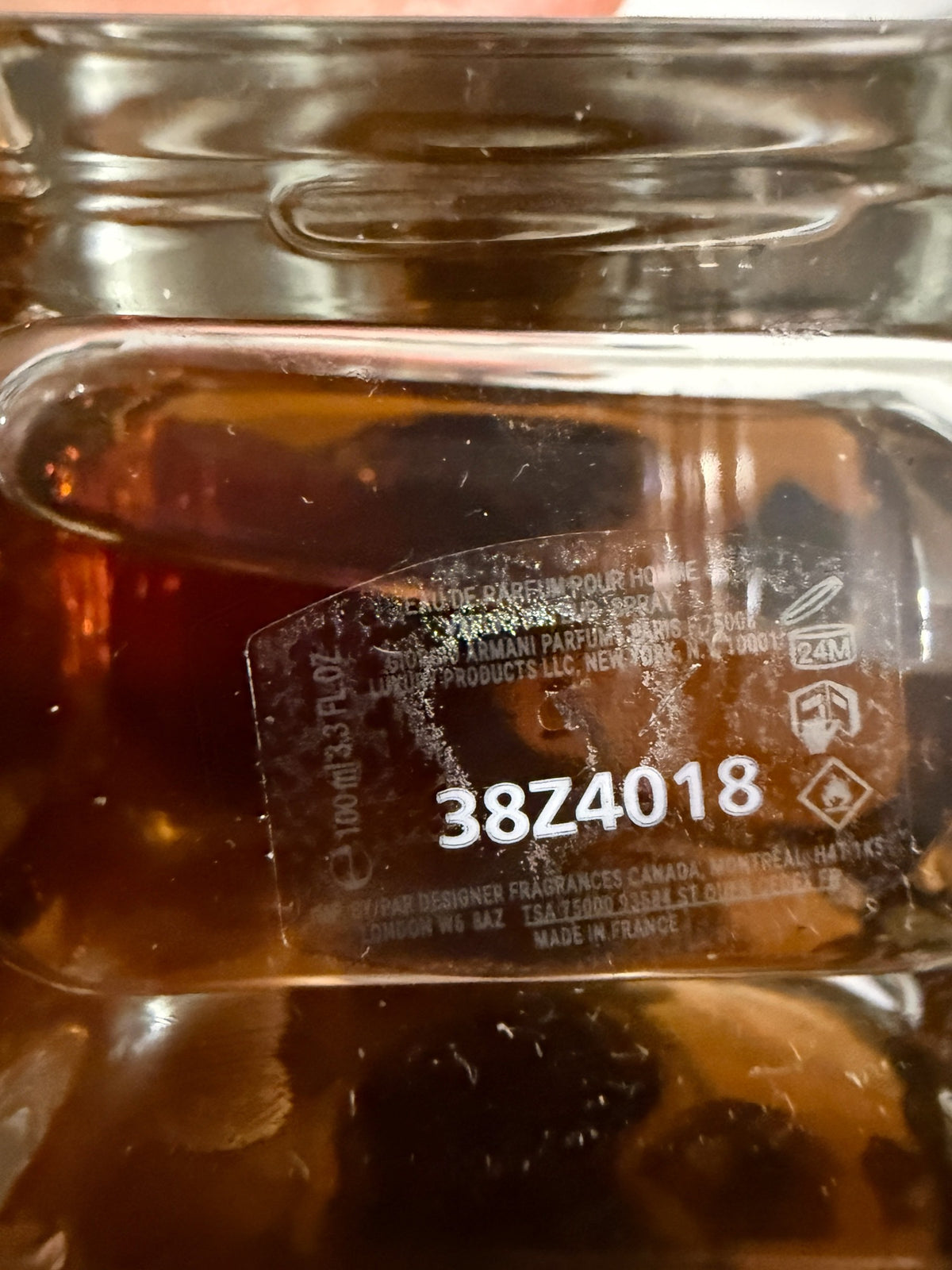 decantME Emporio Armani Stronger With You Intensely perfume bottle showing batch code 38Z4018 on the glass base